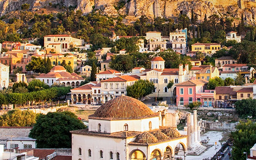 Aerial view of Monastiraki Square and the Acropolis at sunset, Athens, Greece.