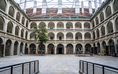 Stallburg Imperial Stables courtyard with arched galleries in Vienna.