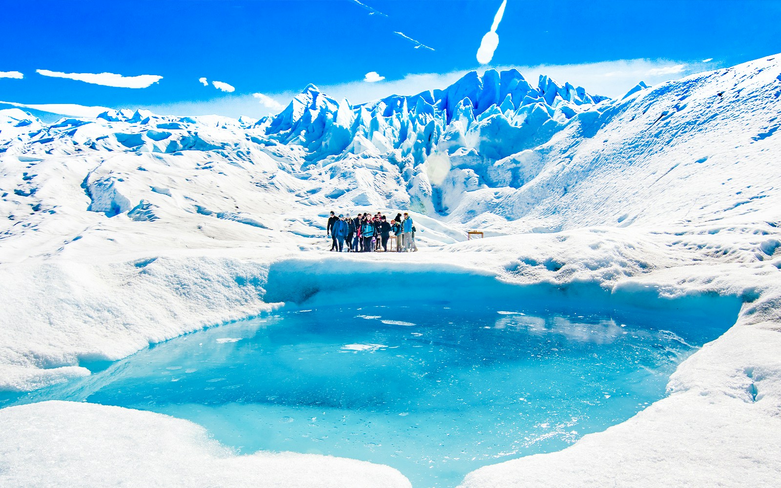 Tourists with guide hiking on Perito Moreno Glacier, Argentina.