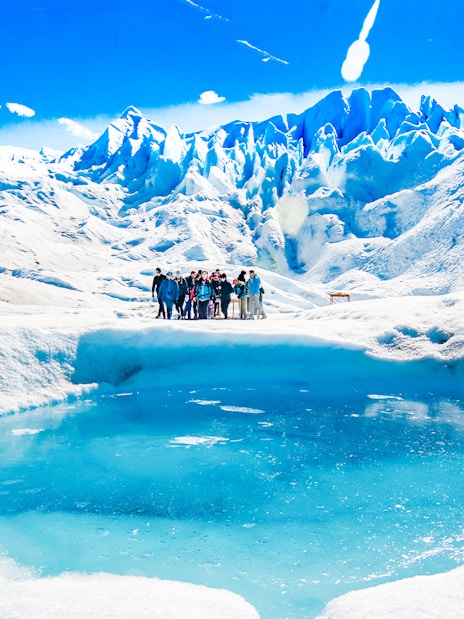 Tourists with guide hiking on Perito Moreno Glacier, Argentina.