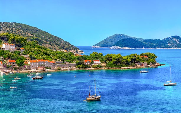 Elaphiti Islands view from a boat tour departing Dubrovnik, showcasing lush landscapes and clear waters.