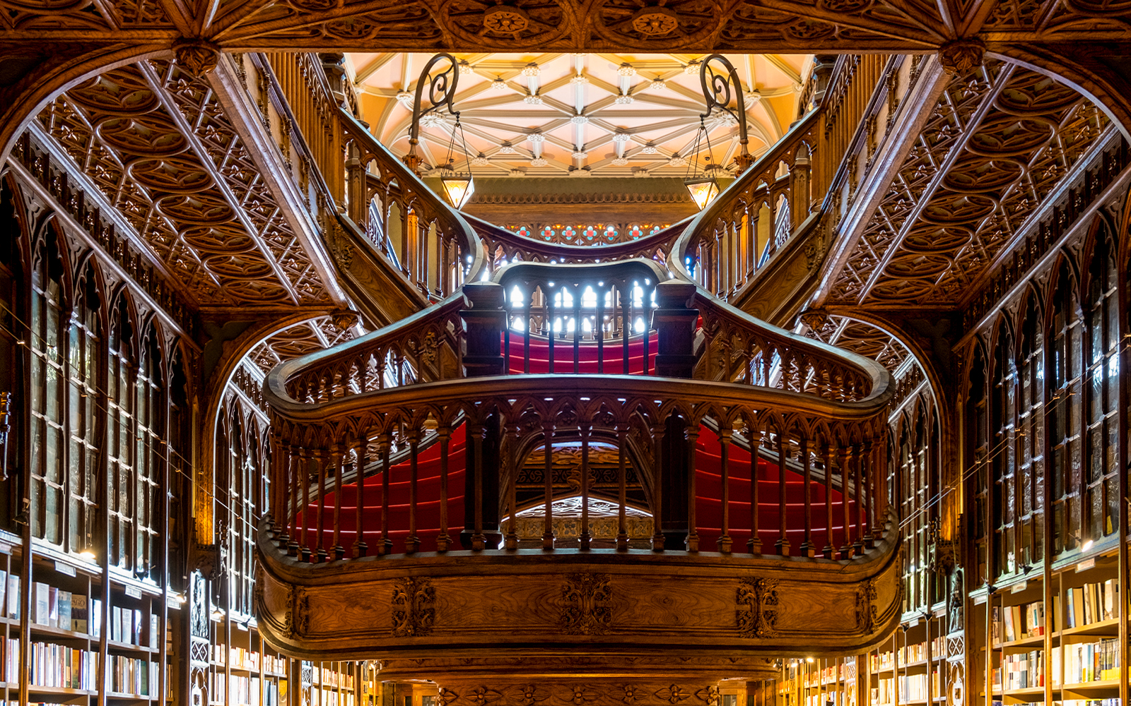 Lello Library's ornate wooden staircase and both floors in Porto, Portugal.