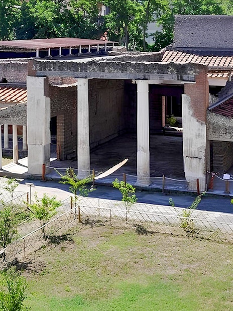 Ancient ruins of Oplontis villa with columns and courtyard, part of Pompeii and Oplontis small group tour.