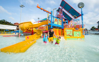 Family enjoying water play area at Singapore's Wild Wild Wet.