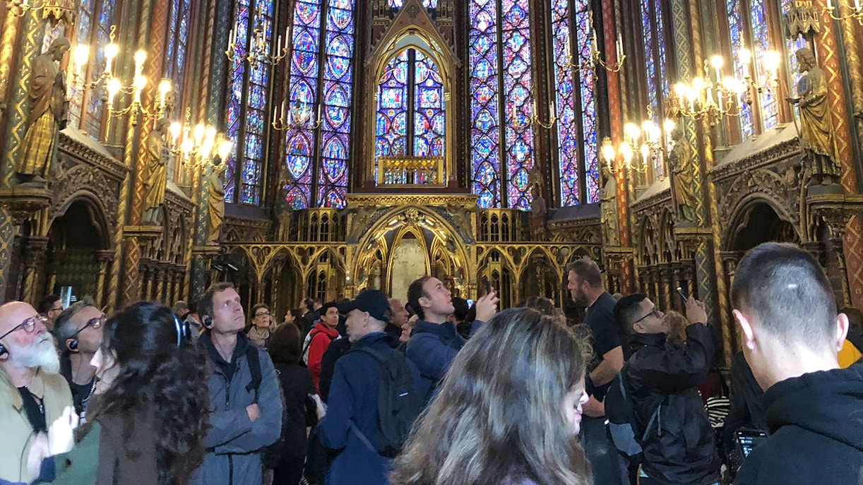 Tourists exploring the stunning interior of Sainte Chapelle, known for its beautiful stained glass windows, during the available Sainte Chapelle timings in Paris, France