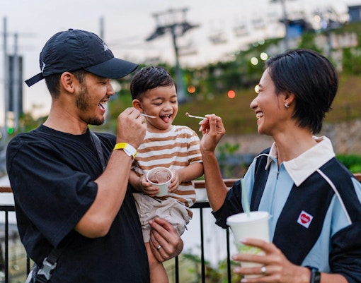 Skyline Luge Kuala Lumpur with families enjoying eating ice cream.