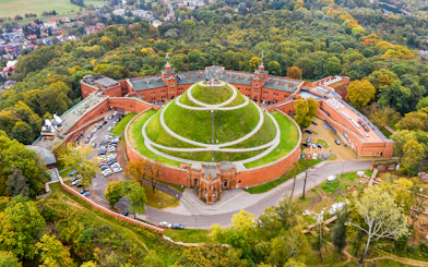 Aerial view of Kościuszko Mound surrounded by trees in Krakow, Poland.