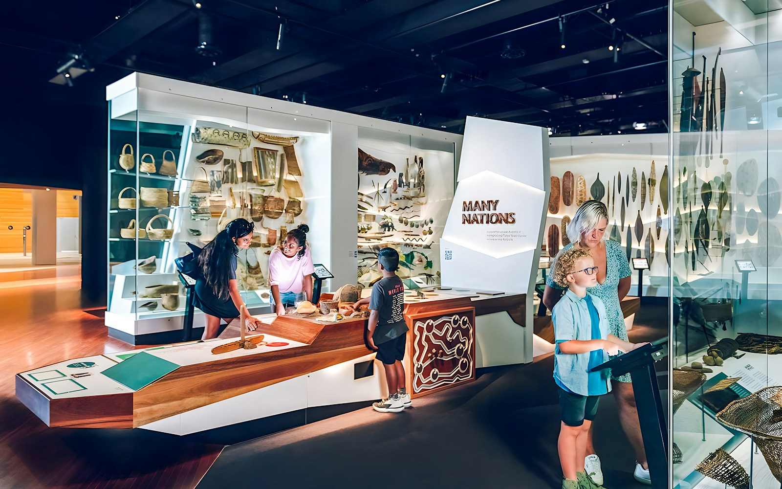 Visitors exploring the Many Nations exhibit at Melbourne Museum.
