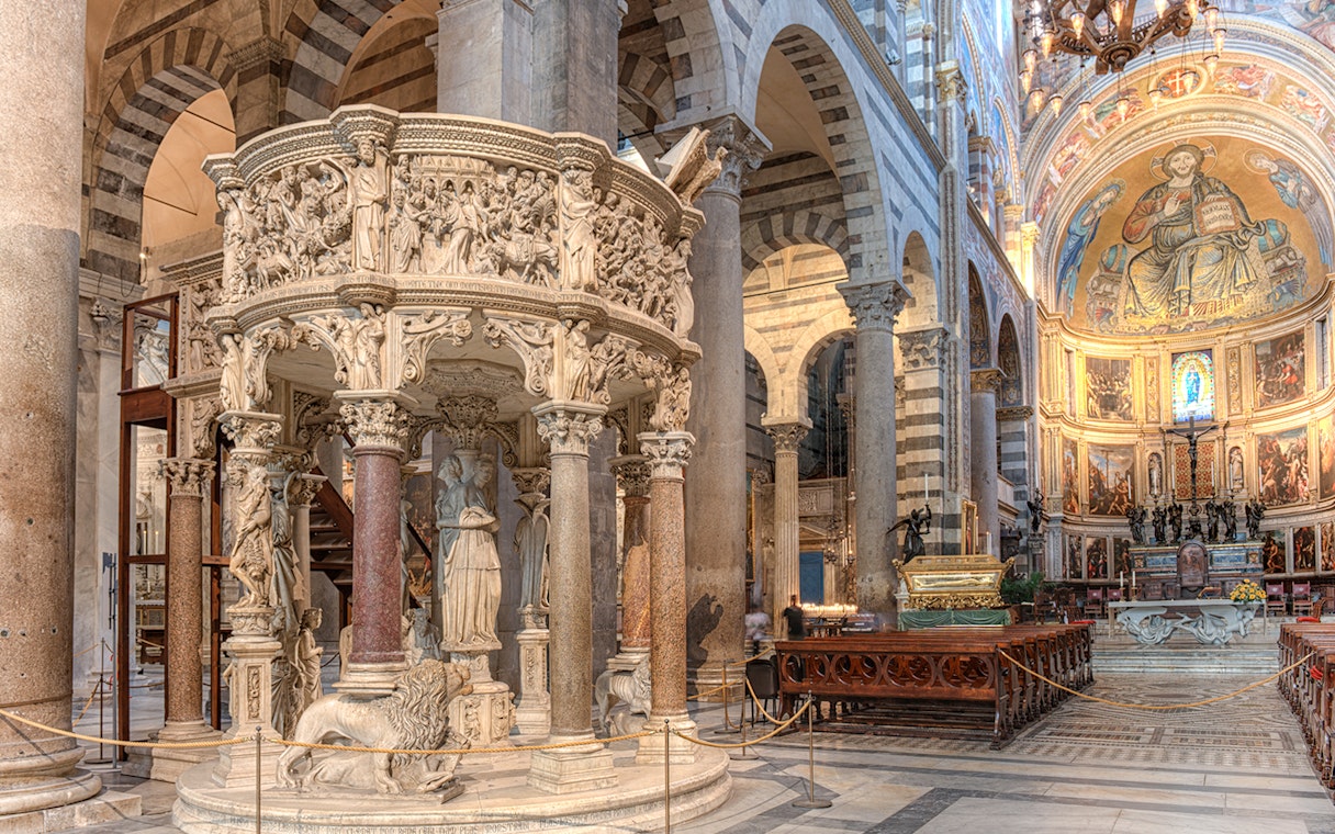 Pulpit with detailed sculptures inside Pisa Cathedral, Italy.