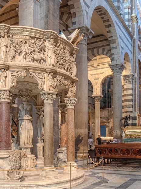 Pulpit with detailed sculptures inside Pisa Cathedral, Italy.