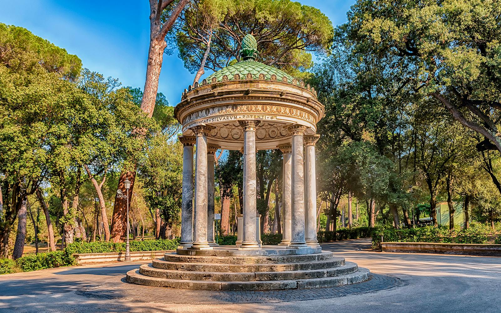 Borghese Gardens temple surrounded by trees, Rome, Italy.