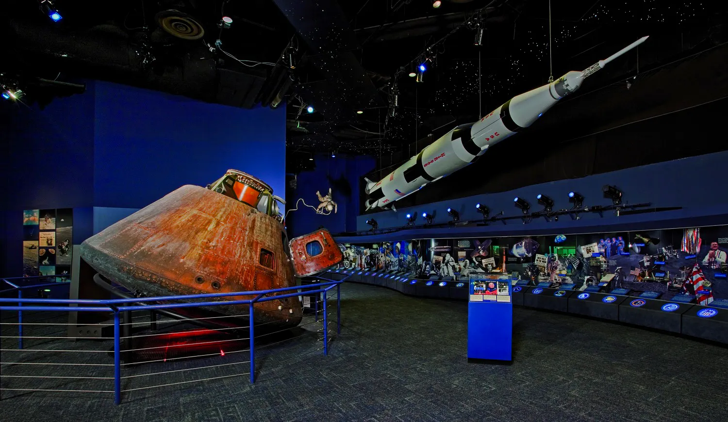 Space Center Houston exhibit with Apollo capsule and Saturn V rocket display.