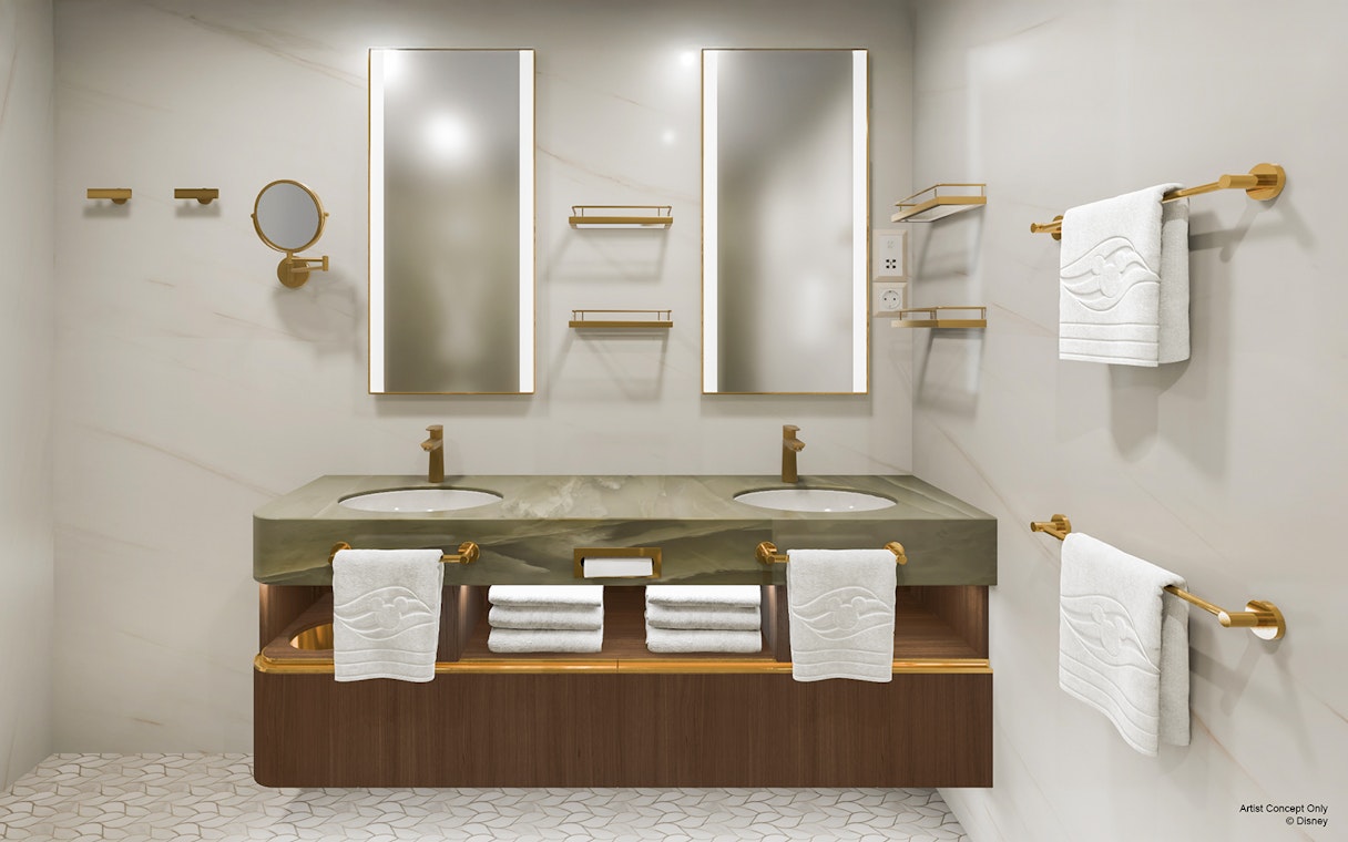 Luxurious bathroom in Concierge Suite, Disney Adventure Cruise, featuring double sinks and elegant decor.