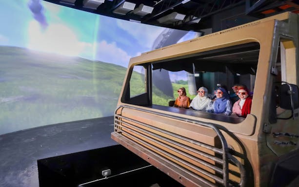 Visitors enjoying a virtual ride experience at Langkawi Cable Car.