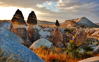 Fairy chimneys at sunset in Cappadocia, part of the Red Tour experience.
