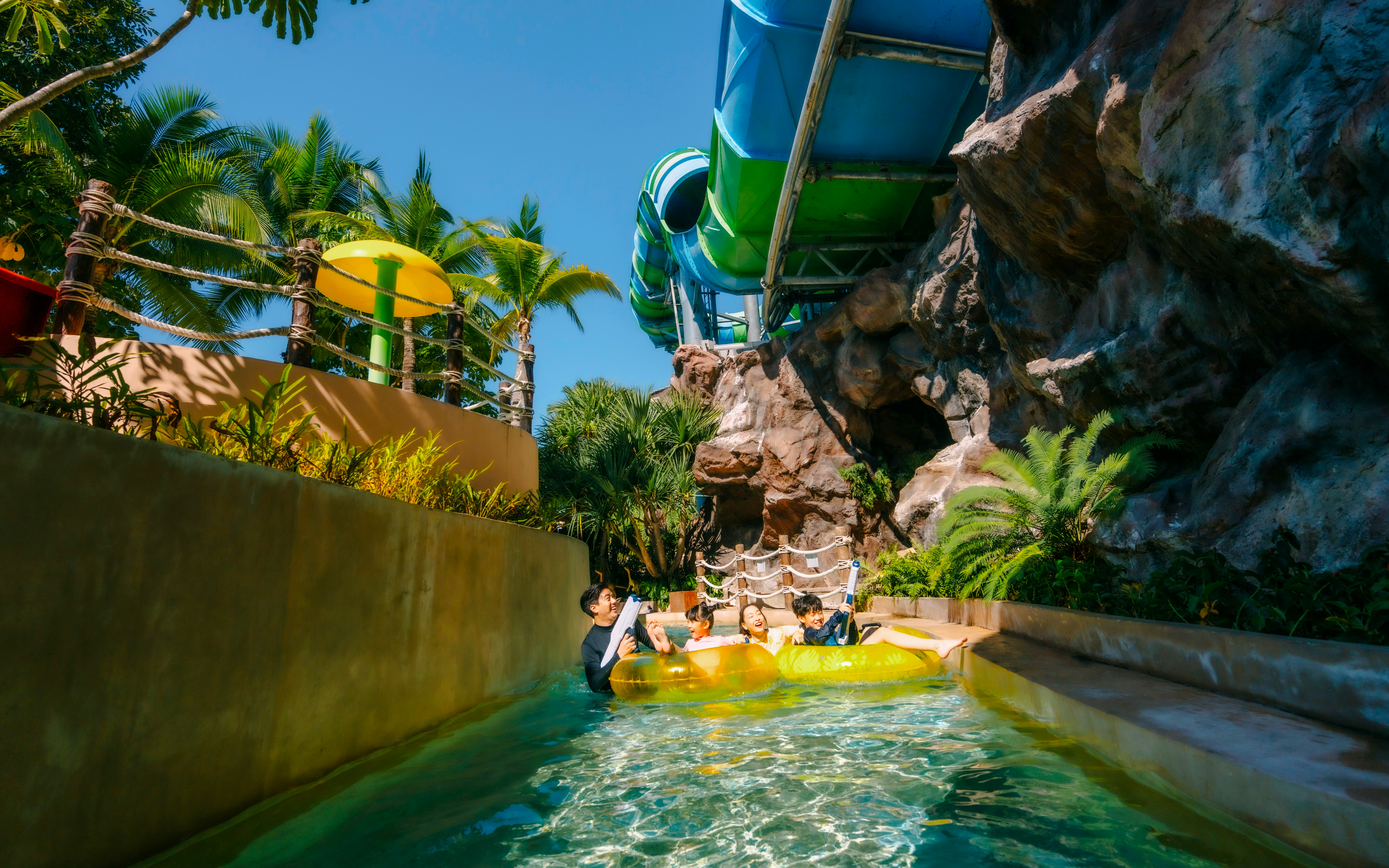 Visitors enjoying a water ride at Vana Nava Water Jungle, Hua Hin.