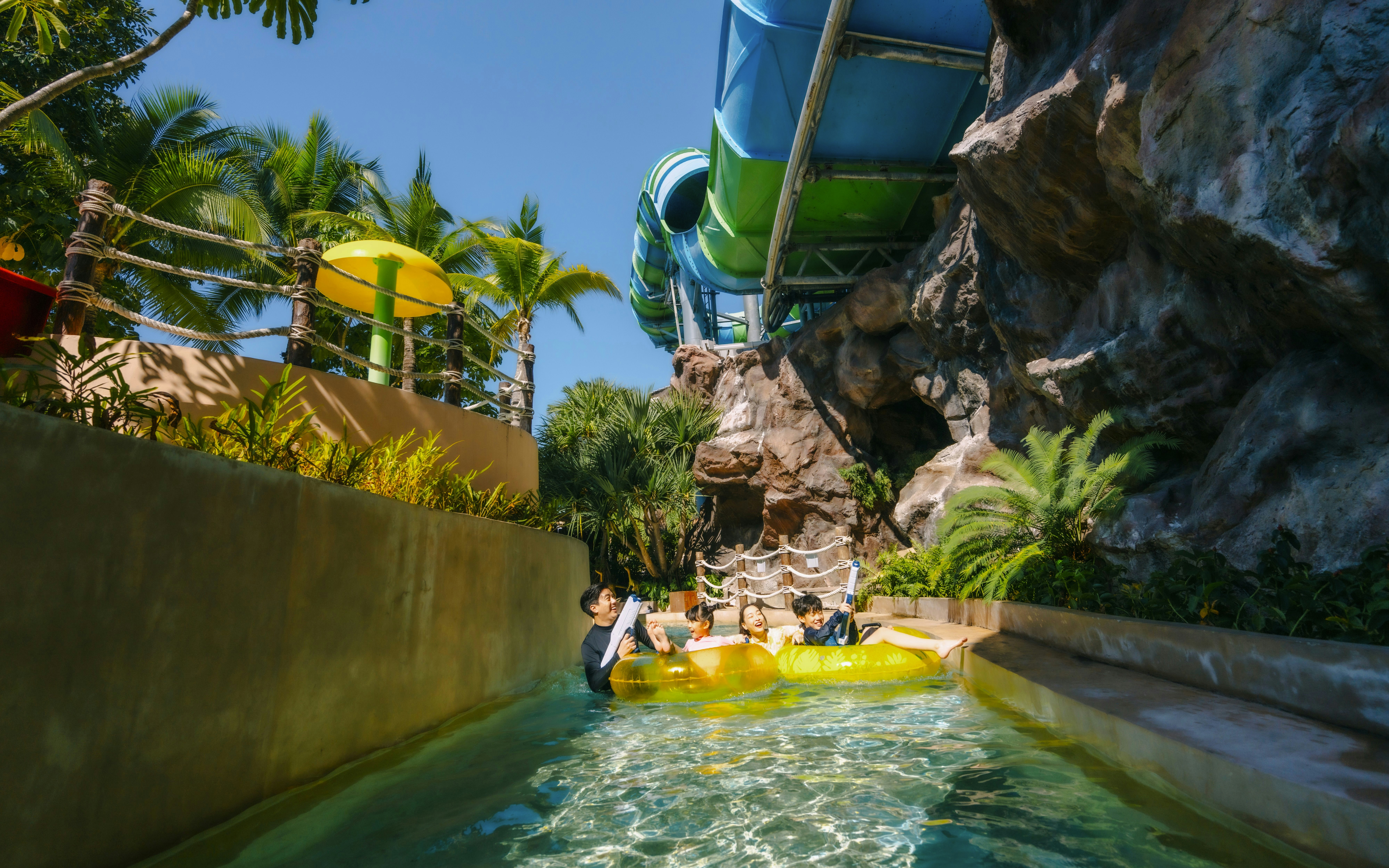 Visitors enjoying a water ride at Vana Nava Water Jungle, Hua Hin.