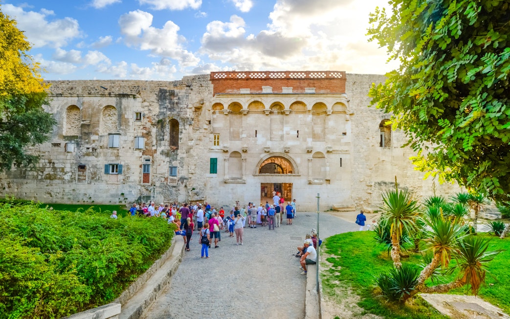 Visitors at the Golden Gate entrance to Diocletian's Palace, Old Town Split, Croatia.