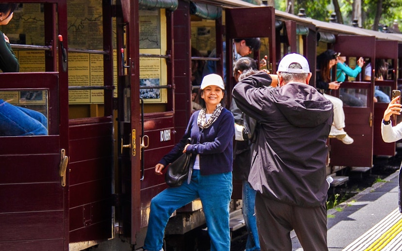 Passengers boarding Puffing Billy steam train vintage carriage near Melbourne station.