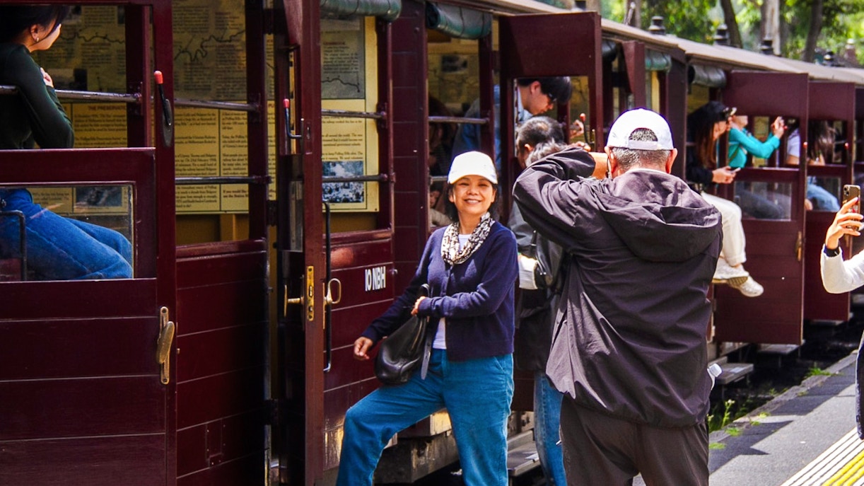 Passengers boarding Puffing Billy steam train vintage carriage near Melbourne station.