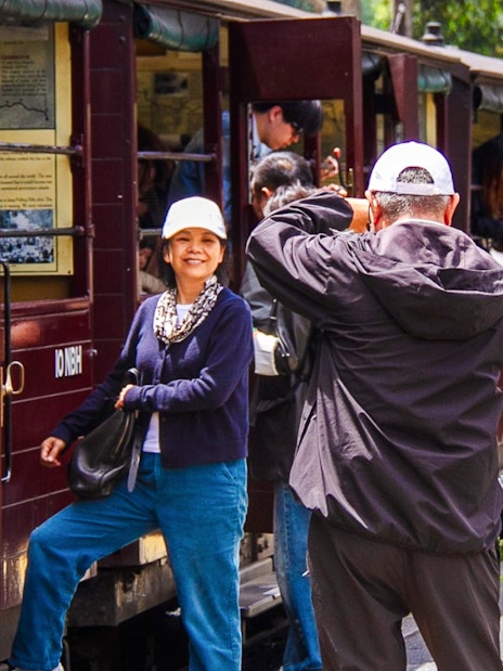 Passengers boarding Puffing Billy steam train vintage carriage near Melbourne station.