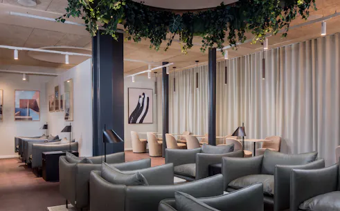 Aspire Lounge seating area with modern decor at Copenhagen Kastrup Airport Terminal 2.