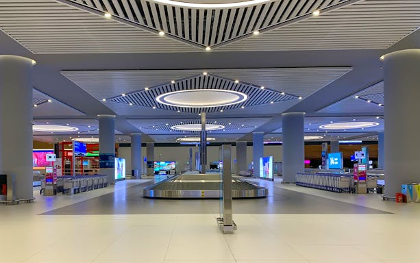 Baggage claim area at New Istanbul Airport for private transfers.