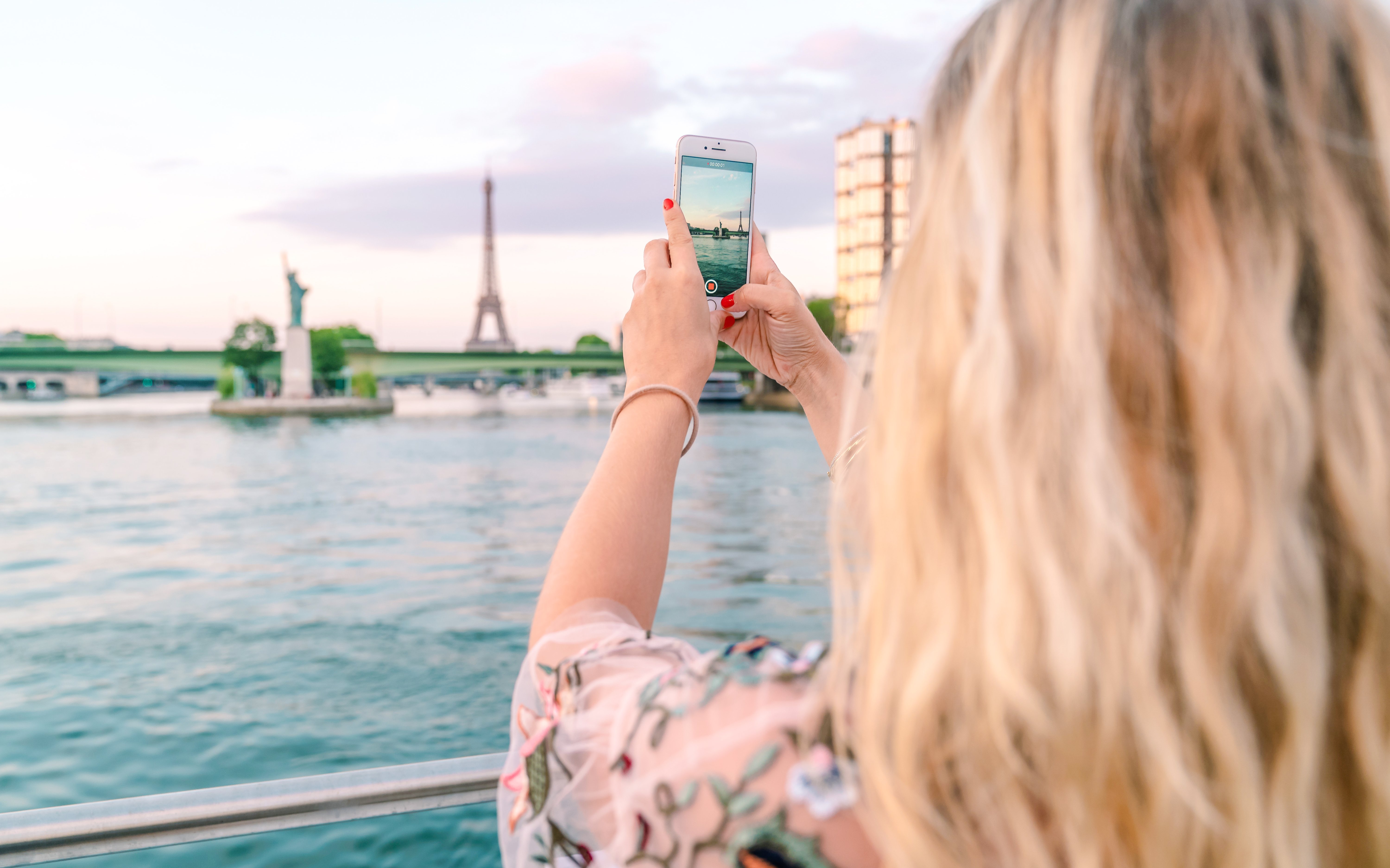 Seine River cruise at evening with Eiffel Tower view in Paris.