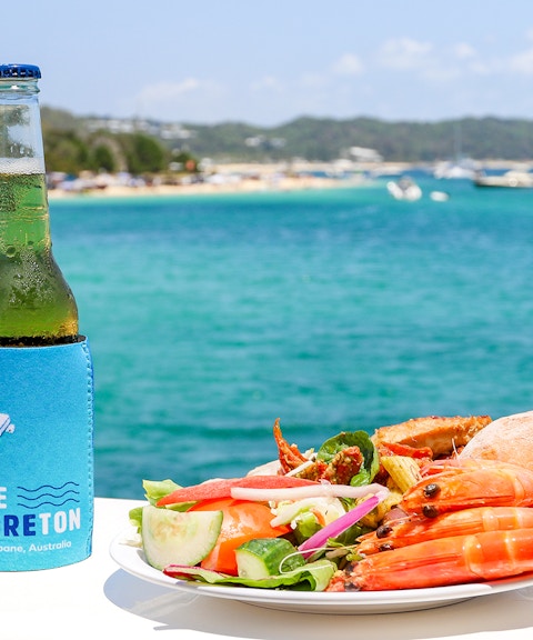 Seafood platter and drink with Moreton Bay view in Brisbane, Australia.