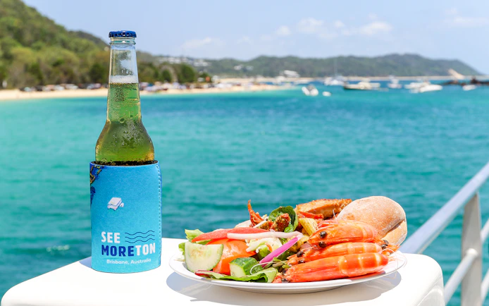 Seafood platter and drink with Moreton Bay view in Brisbane, Australia.