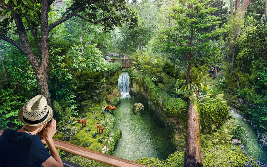 Tourists photographing wildlife near a waterfall in Rainforest Wild Asia.
