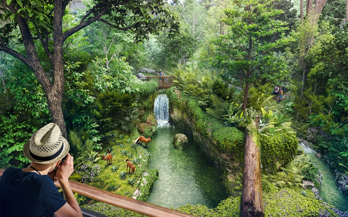 Tourists photographing wildlife near a waterfall in Rainforest Wild Asia.