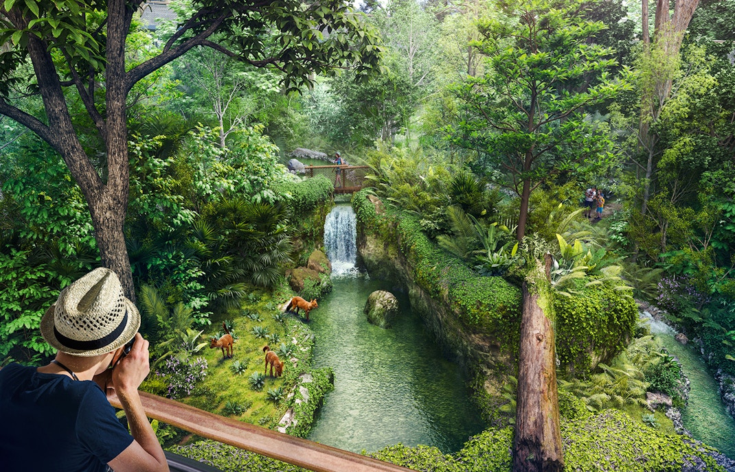 Tourists photographing wildlife near a waterfall in Rainforest Wild Asia.