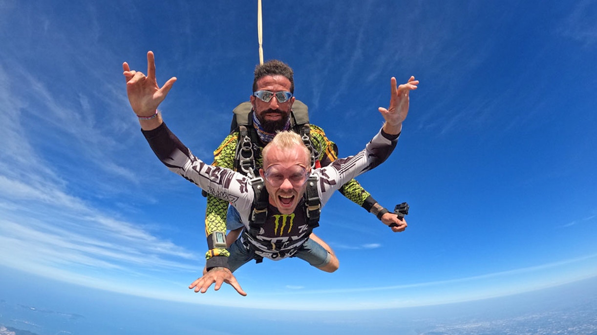 Skydiver tandem jumping at 13000 ft over Pattaya, Thailand.
