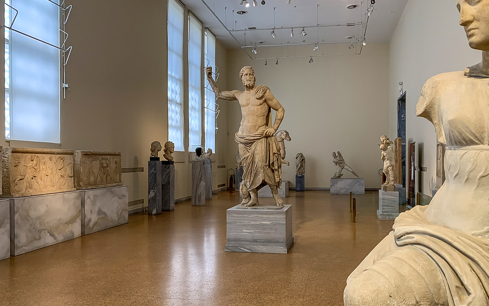 Exhibits of ancient sculptures inside National Archaeological Museum.