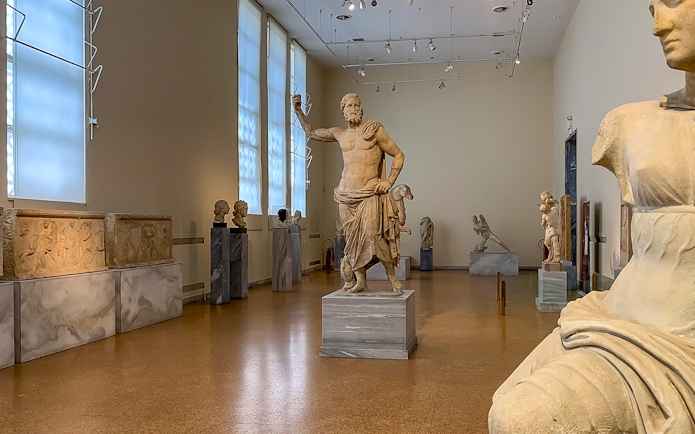 Exhibits of ancient sculptures inside National Archaeological Museum.