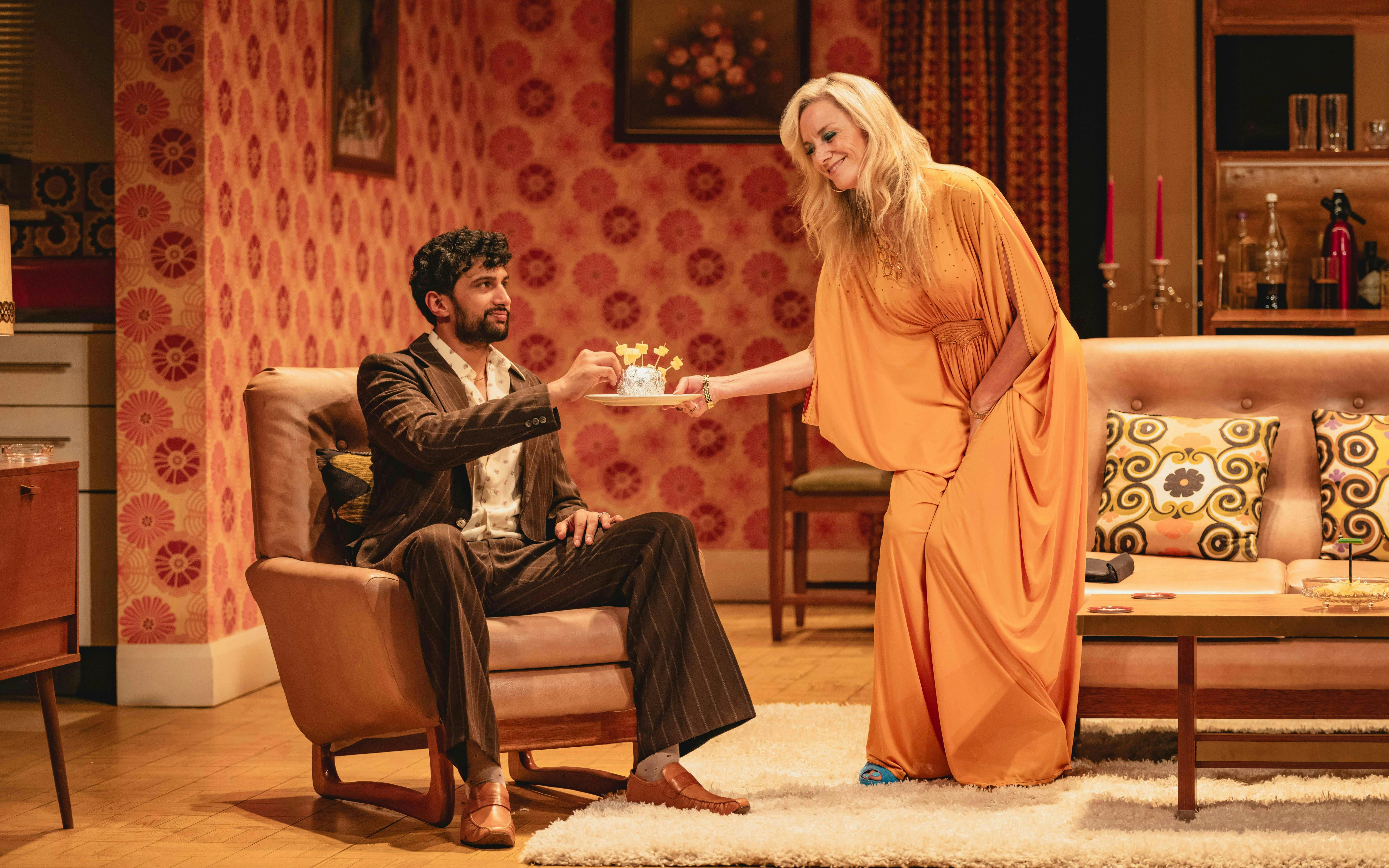 Stage scene from Abigail's Party, Westend, with two actors in a living room setting.