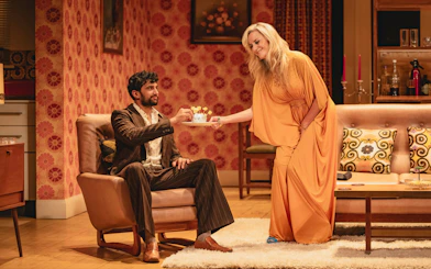 Stage scene from Abigail's Party, Westend, with two actors in a living room setting.