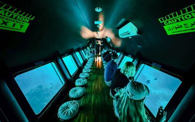 People viewing fish through windows on Royal Seascope Submarine, Hurghada.