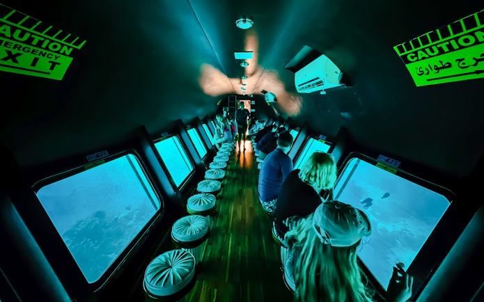 People viewing fish through windows on Royal Seascope Submarine, Hurghada.
