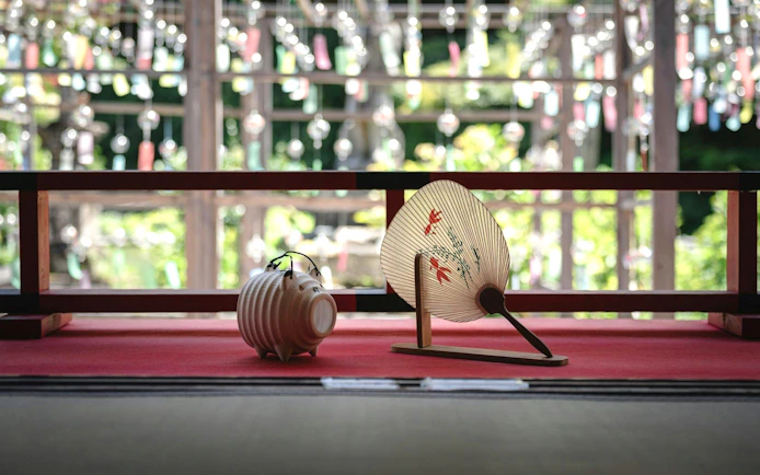 Wind chimes and traditional fan at Kyoto Summer Limited Wind Chime Festival.