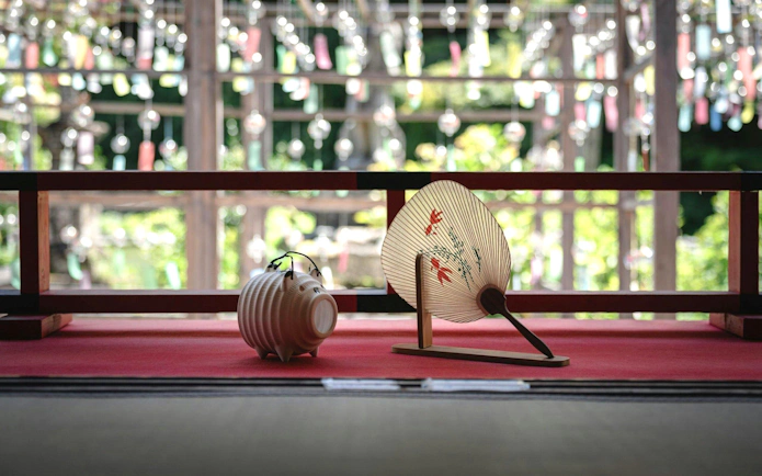 Wind chimes and traditional fan at Kyoto Summer Limited Wind Chime Festival.