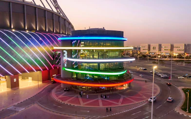Qatar Olympic And Sports Museum exterior with colorful lights, Doha.
