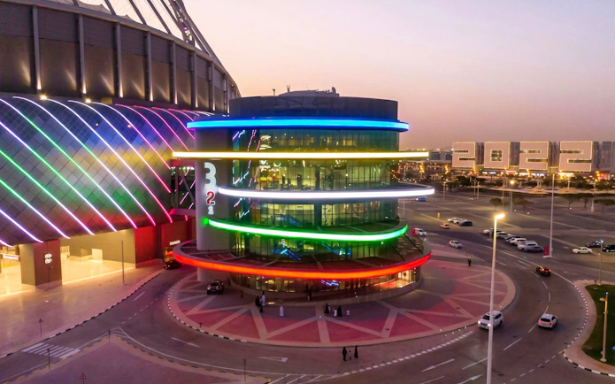 Qatar Olympic And Sports Museum exterior with colorful lights, Doha.