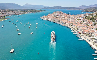 Aerial view of a cruise ship approaching Poros Island during the Athens Day Cruise.