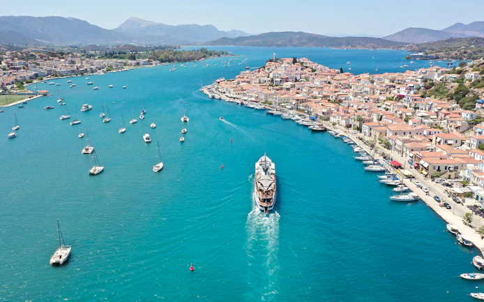 Aerial view of a cruise ship approaching Poros Island during the Athens Day Cruise.