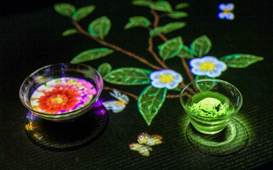 Interactive digital art with floral projections at teamLab SuperNature Macau.