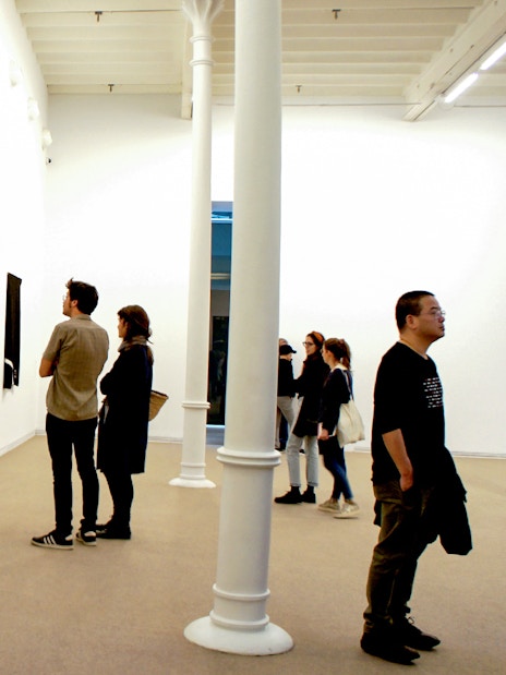 Visitors viewing abstract art at Fundació Antoni Tàpies, Barcelona.
