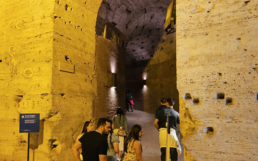 Visitors exploring the ancient corridors of Castel Sant'Angelo in Rome.