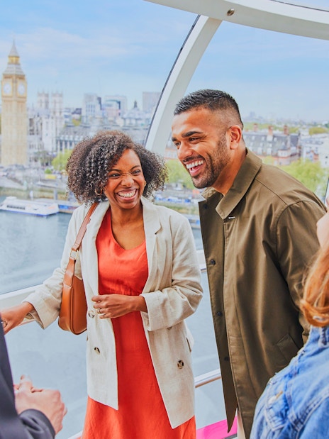 Group enjoying a ride on the London Eye with Big Ben in the background.
